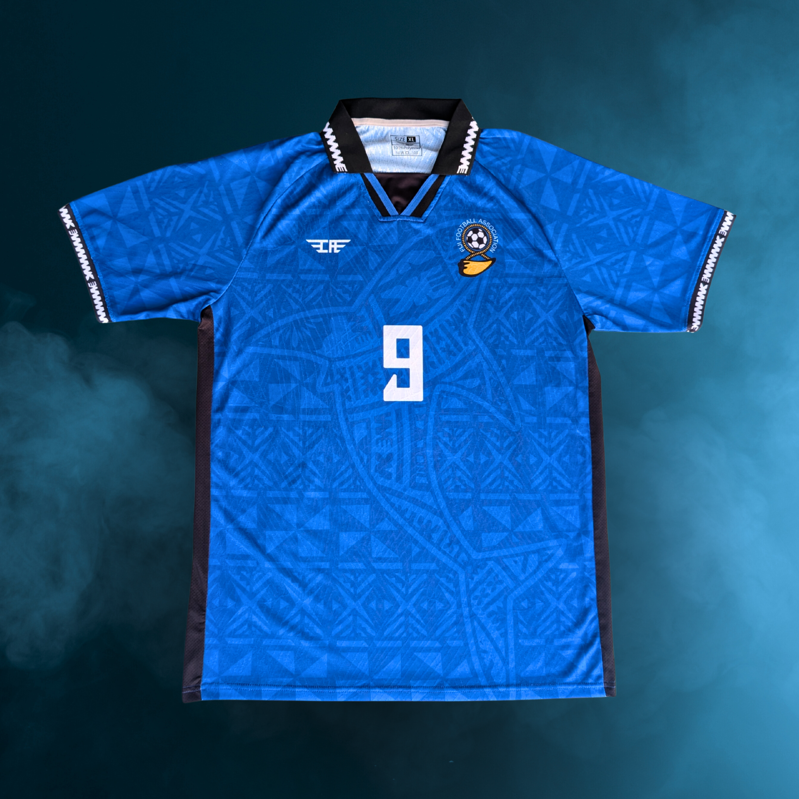 Fiji football men uniform away blue performance jersey with tribal pattern, number print, and national crest, custom team kit by Custom Athletics USA for players and supporters.