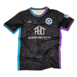 Augusta soccer team home uniform black performance jersey with custom geometric pattern, sponsor logo, and club crest, designed and manufactured by Custom Athletics USA for competitive teams.